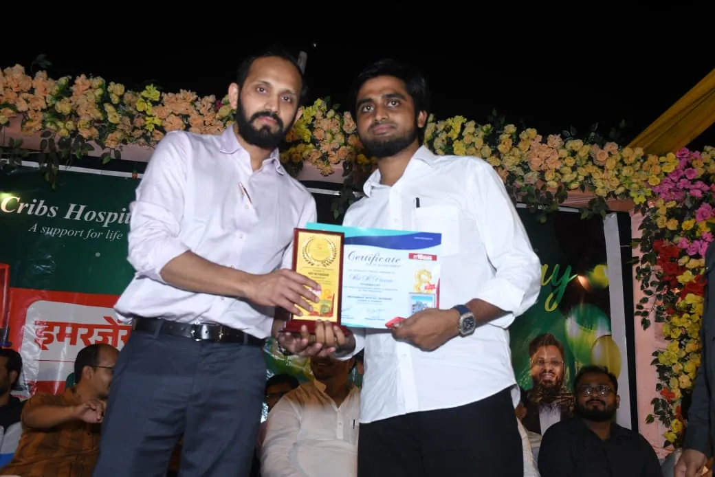Dr. Abu Ammar Rizvi being felicitated at a Cribs Hospital event