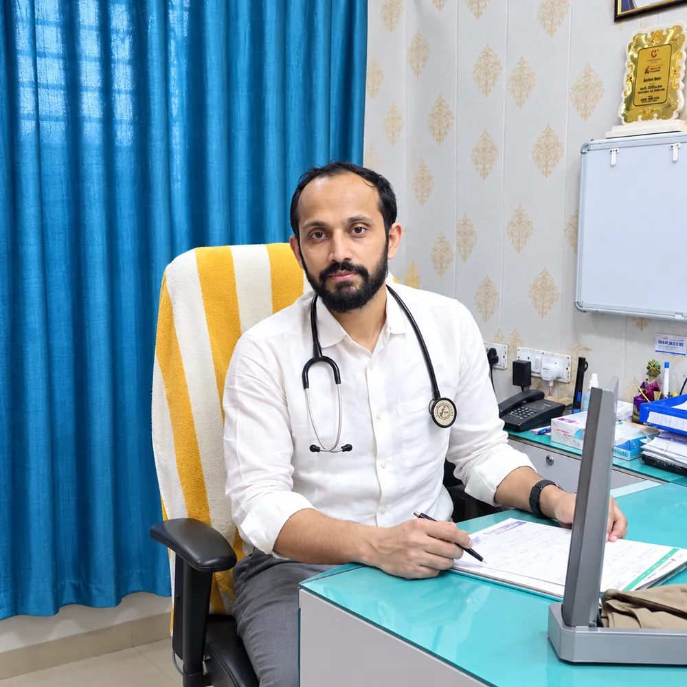 Dr. Abu Ammar Rizvi at his consultation desk, Cribs Hospital, Madhubani