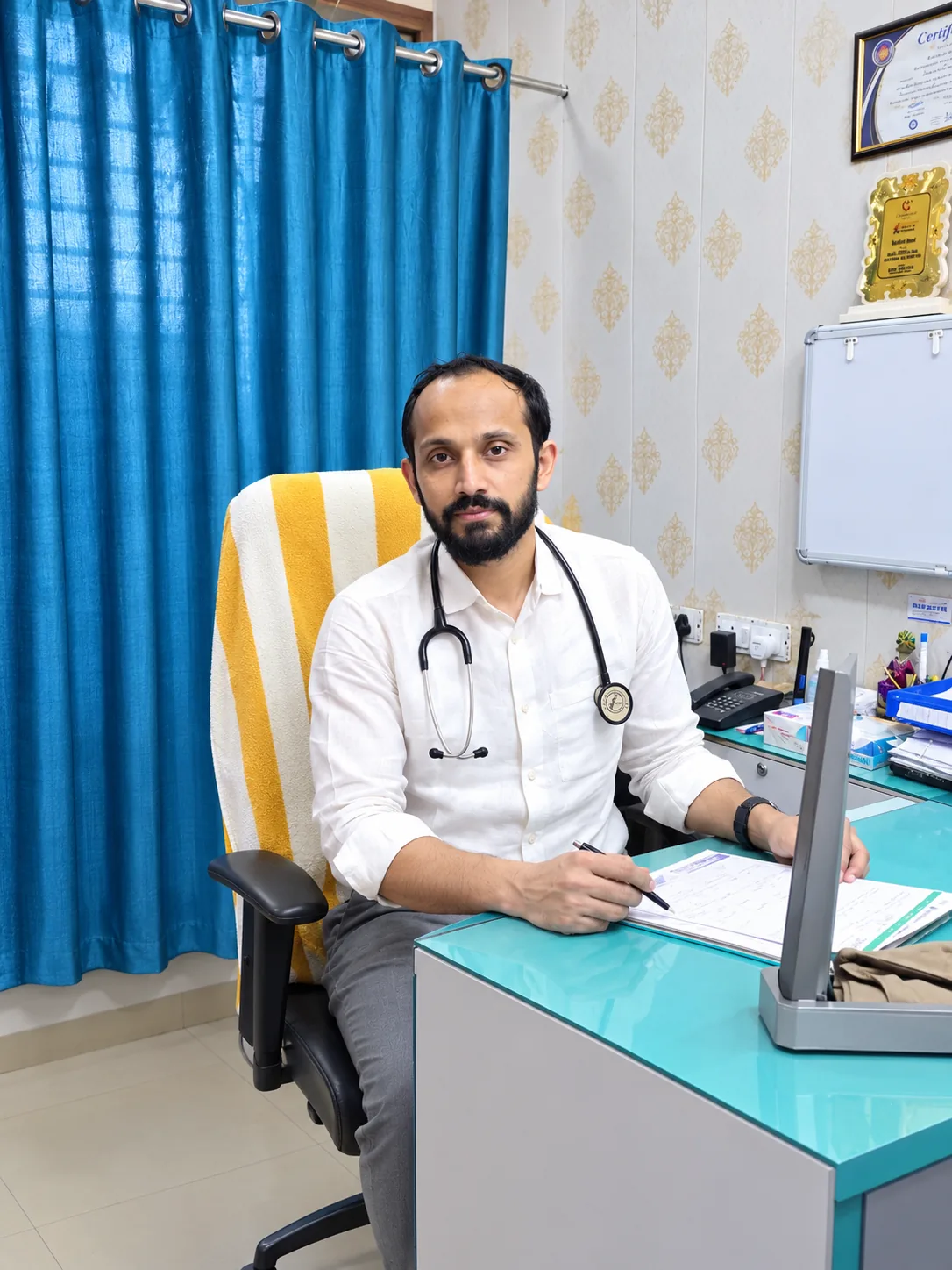 Dr. Abu Ammar Rizvi at his clinic desk