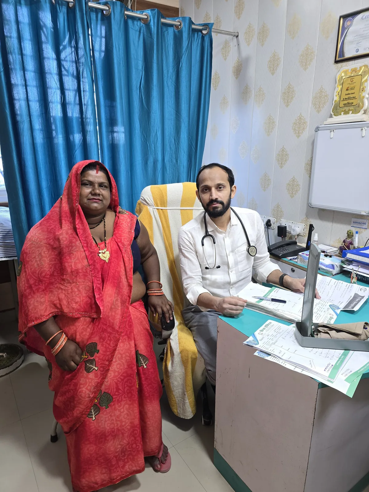 Dr. Rizvi with a patient in the consultation room