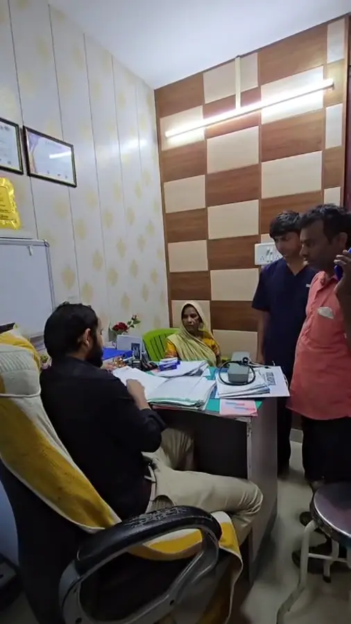 Dr. Rizvi consulting a patient in the OPD